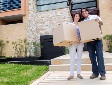 Professional movers handling furniture during a Colindale move