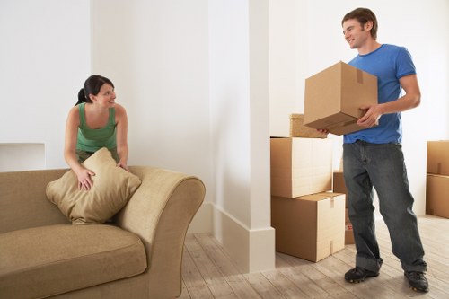 Furniture and boxes being organised for local storage